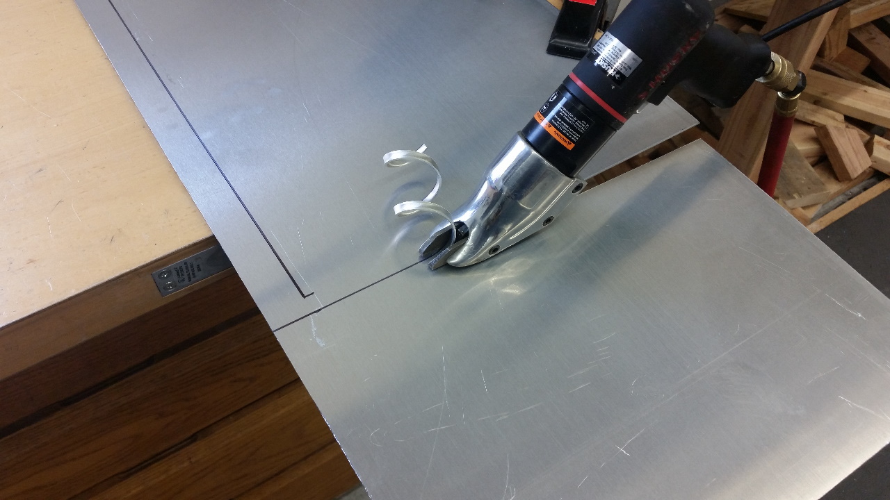 Cutting sheet metal with air powered shears