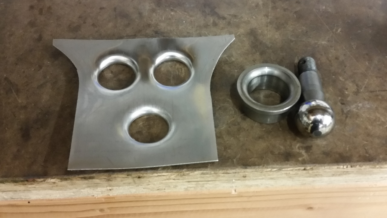 DIY flanged holes using ball joint and wheel bearing race.